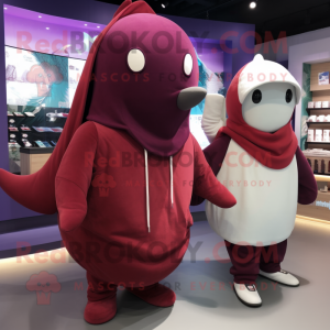 Maroon Narwhal mascot costume character dressed with a Hoodie and Berets