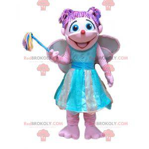 Mascot bastante hada rosa y azul muy colorida y sonriente -