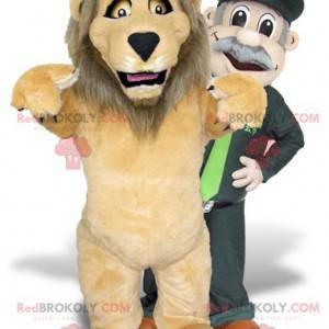 2 mascotas, un león marrón y un cuidador del zoológico -