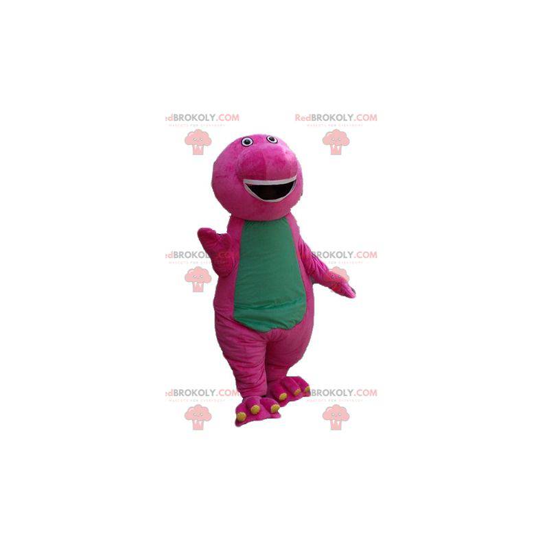 Baculatý a zábavný obří růžový a zelený dinosaur maskot -