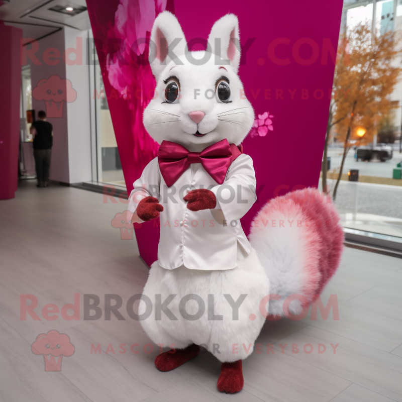 Magenta Squirrel mascot costume character dressed with a Wedding Dress and Bow ties Magenta Squirrel mascot costume character dressed with a Wedding Dress and Bow ties