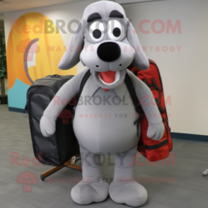 Gray Hot Dogs mascot costume character dressed with a Suit Pants and Backpacks