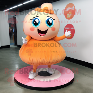 Peach Donut mascot costume character dressed with a Skirt and Foot pads