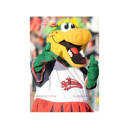 Mascote crocodilo verde e amarelo muito sorridente -
