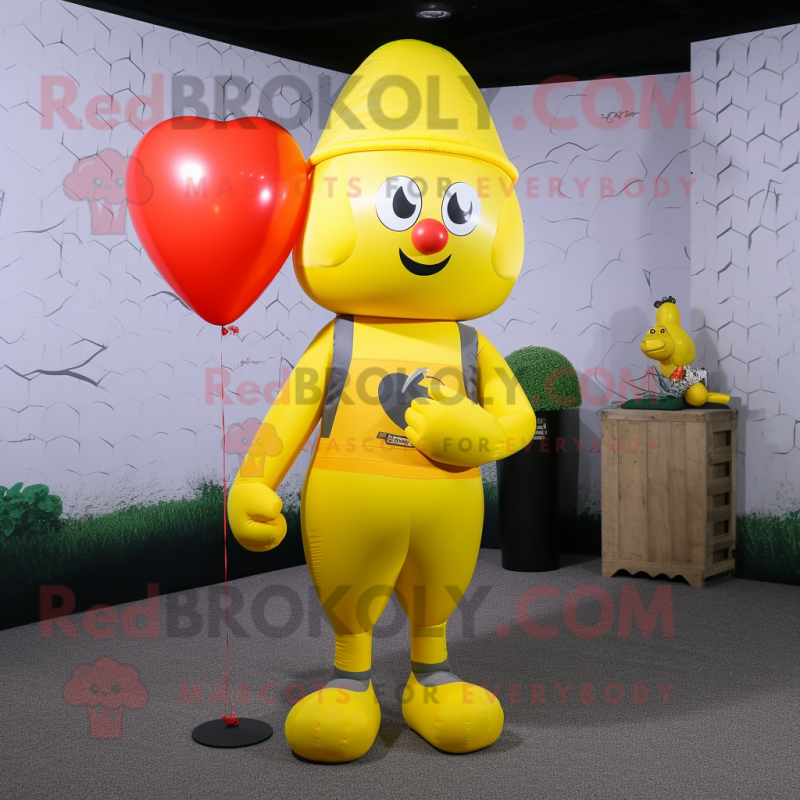 Yellow Heart Shaped Balloons mascot costume character dressed with a Jumpsuit and Beanies Yellow Heart Shaped Balloons mascot costume character dressed with a Jumpsuit and Beanies