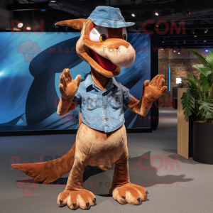 Brown Pterodactyl mascot costume character dressed with a Denim Shirt and Foot pads