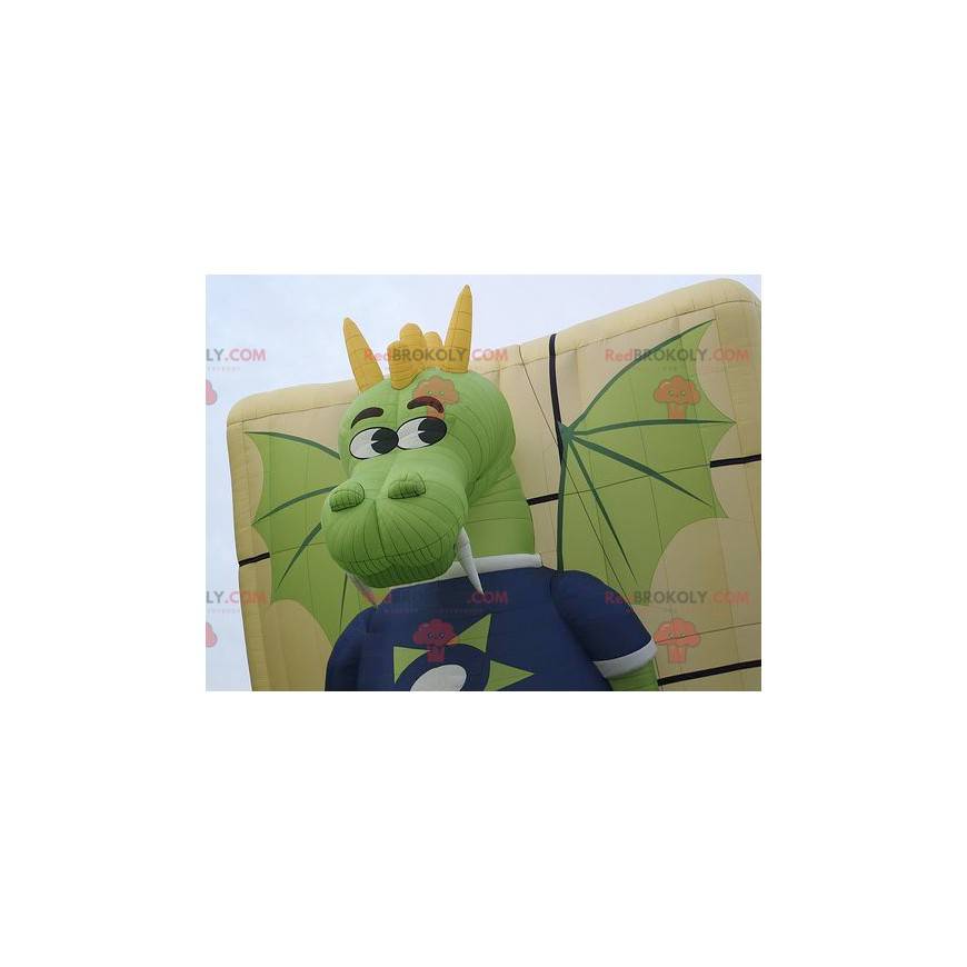 Funny and colorful green and yellow dragon mascot -