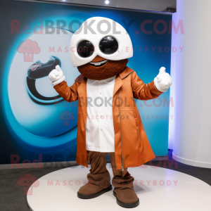 Rust Golf Ball mascot costume character dressed with a Moto Jacket and Rings