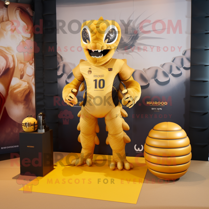 Gold Hydra mascot costume character dressed with a Rugby Shirt and Wallets