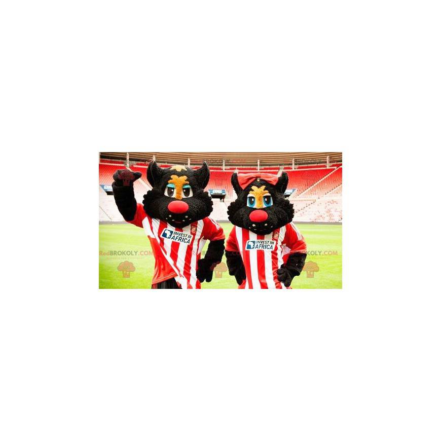2 Maskottchen von schwarzen und roten Katzen in Sportbekleidung