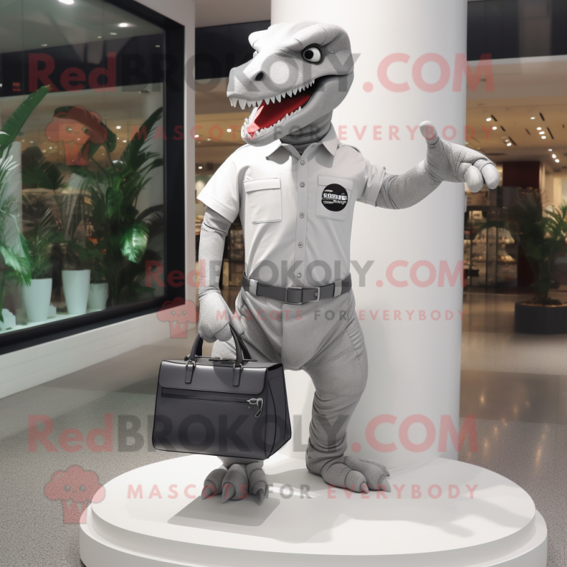 Silver Tyrannosaurus mascot costume character dressed with a Polo Tee and Handbags