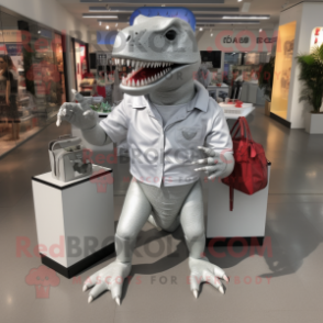 Silver Tyrannosaurus mascot costume character dressed with a Polo Tee and Handbags