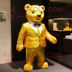 Gold Bear mascot costume character dressed with a Polo Tee and Tie pins