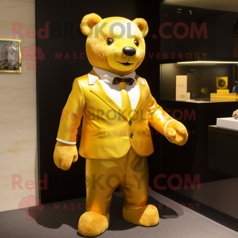 Gold Bear mascot costume character dressed with a Polo Tee and Tie pins