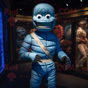 Blue Mummy mascot costume character dressed with a Rash Guard and Suspenders