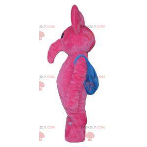 Rosa Elefantenmaskottchen mit einer blauen Schultasche -