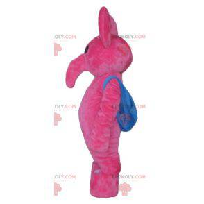 Rosa Elefantenmaskottchen mit einer blauen Schultasche -