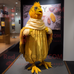 Gold Chicken mascot costume character dressed with a Bermuda Shorts and Shawl pins