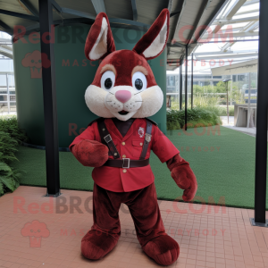 Maroon Rabbit mascot costume character dressed with a Polo Shirt and Belts