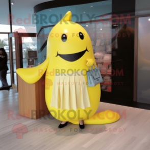 Lemon Yellow Whale mascot costume character dressed with a Maxi Skirt and Wallets