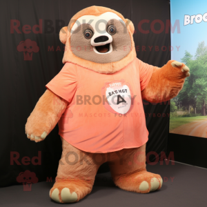 Peach Giant Sloth mascot costume character dressed with a Flannel Shirt and Foot pads