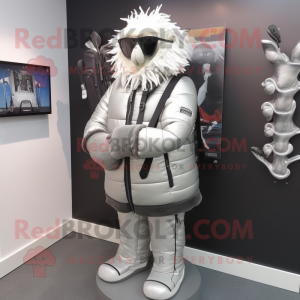Silver Golf Bag mascot costume character dressed with a Leather Jacket and Shawl pins