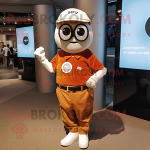 Rust Golf Ball mascot costume character dressed with a Button-Up Shirt and Smartwatches