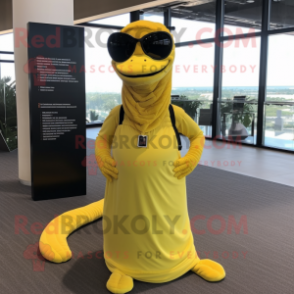 Yellow Titanoboa mascot costume character dressed with a Pleated Skirt and Eyeglasses