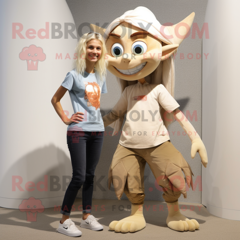 Tan Tooth Fairy mascot costume character dressed with a Skinny Jeans and Foot pads Tan Tooth Fairy mascot costume character dressed with a Skinny Jeans and Foot pads