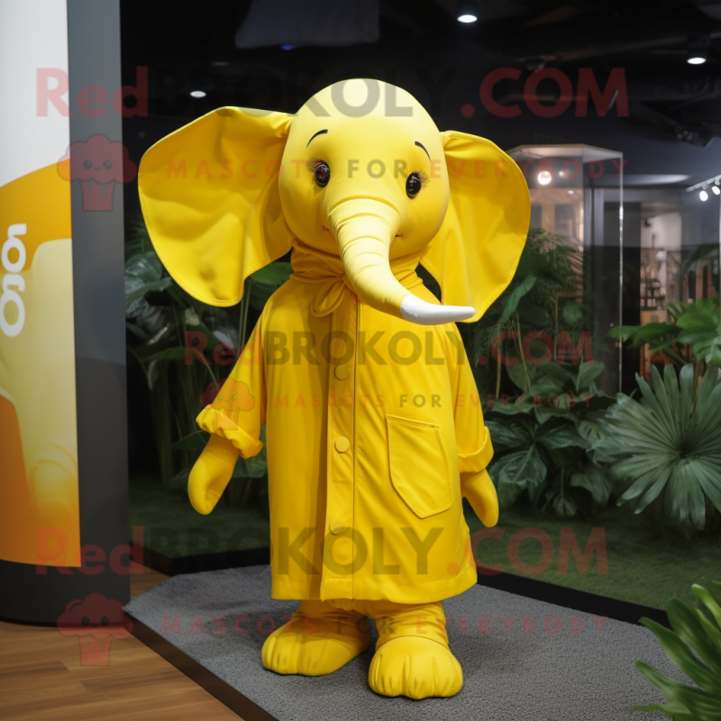 Yellow Elephant mascot costume character dressed with a Raincoat and Scarf clips