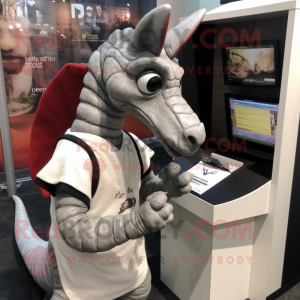 Gray Parasaurolophus mascot costume character dressed with a Sweatshirt and Reading glasses