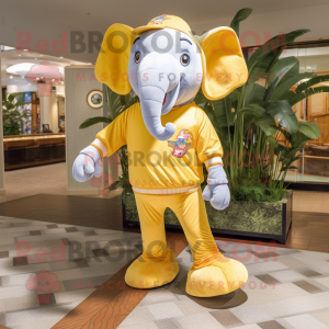Gold Elephant mascot costume character dressed with a Bermuda Shorts and Anklets