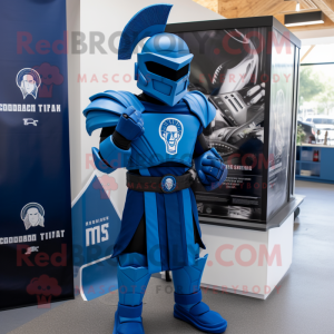 Blue Spartan Soldier mascot costume character dressed with a Graphic Tee and Lapel pins