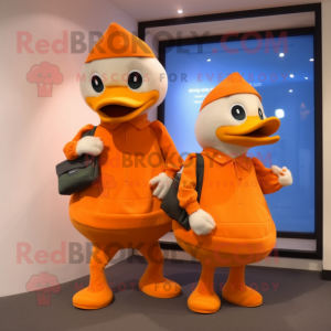 Orange Geese mascot costume character dressed with a Capri Pants and Messenger bags
