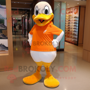 Orange Geese mascot costume character dressed with a Capri Pants and Messenger bags