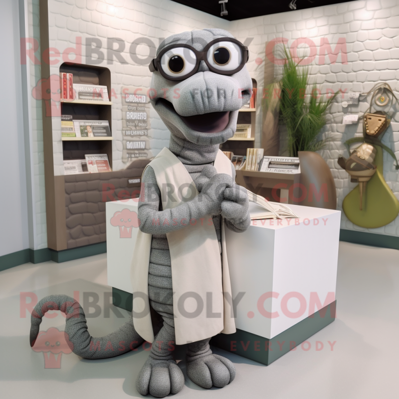 Silver Titanoboa mascot costume character dressed with a Cardigan and Reading glasses