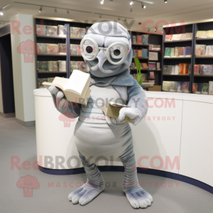 Silver Titanoboa mascot costume character dressed with a Cardigan and Reading glasses