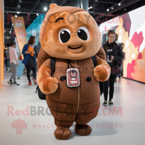 Brown Croissant mascot costume character dressed with a Hoodie and Backpacks