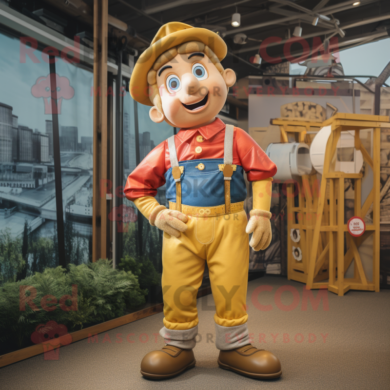 Gold Acrobat mascot costume character dressed with a Dungarees and Hat pins Gold Acrobat mascot costume character dressed with a Dungarees and Hat pins
