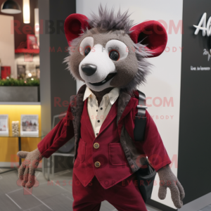 Maroon Aye-Aye mascot costume character dressed with a Blazer and Suspenders