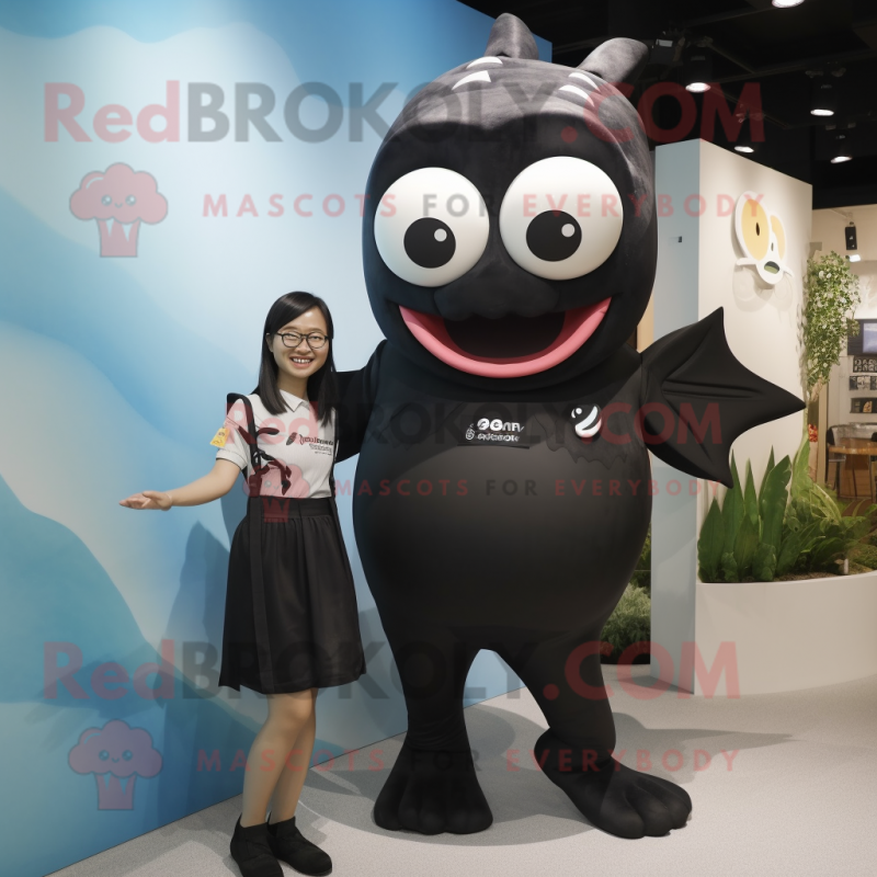 Black Cod mascot costume character dressed with a One-Piece Swimsuit and Watches