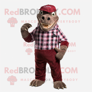 Maroon Iguanodon mascot costume character dressed with a Flannel Shirt and Clutch bags