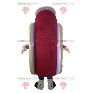 Leuke en kleurrijke gigantische hotdogmascotte met een hoed -