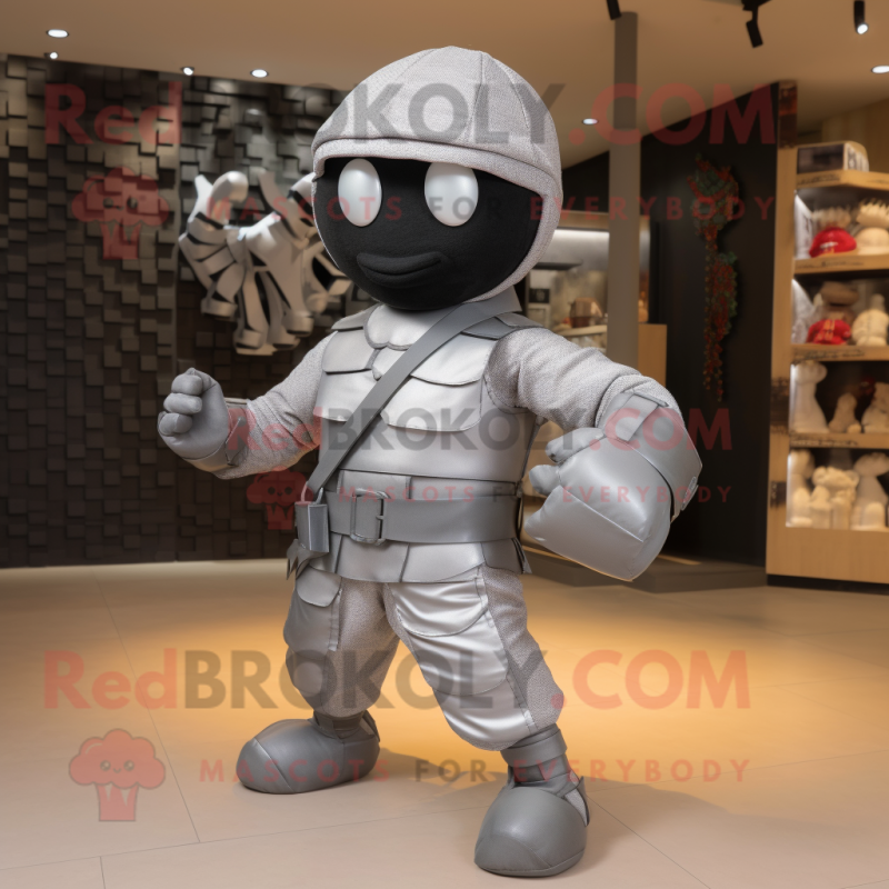 Silver Ninja mascot costume character dressed with a Cargo Pants and Handbags Silver Ninja mascot costume character dressed with a Cargo Pants and Handbags