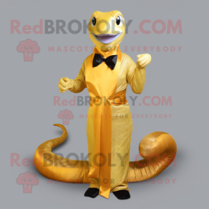 Gold Titanoboa mascot costume character dressed with a Sheath Dress and Bow ties