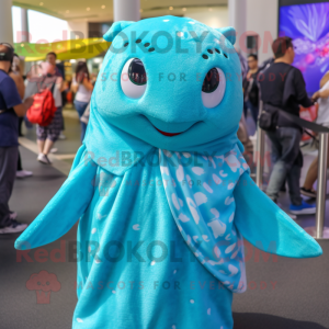 Turquoise Stingray mascot costume character dressed with a Cover-up and Hair clips
