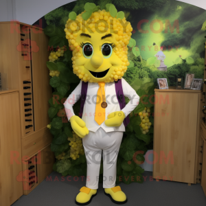 Yellow Grape mascot costume character dressed with a Waistcoat and Hairpins