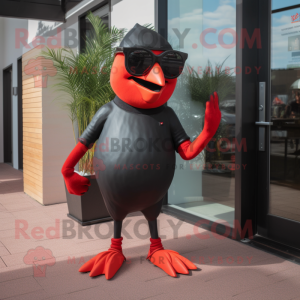 Red Blackbird mascot costume character dressed with a Jeggings and Sunglasses