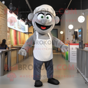 Gray Falafel mascot costume character dressed with a Polo Shirt and Suspenders