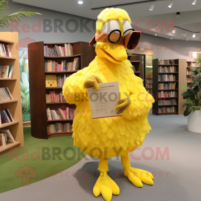 Yellow Dodo Bird mascot costume character dressed with a Wrap Skirt and Reading glasses